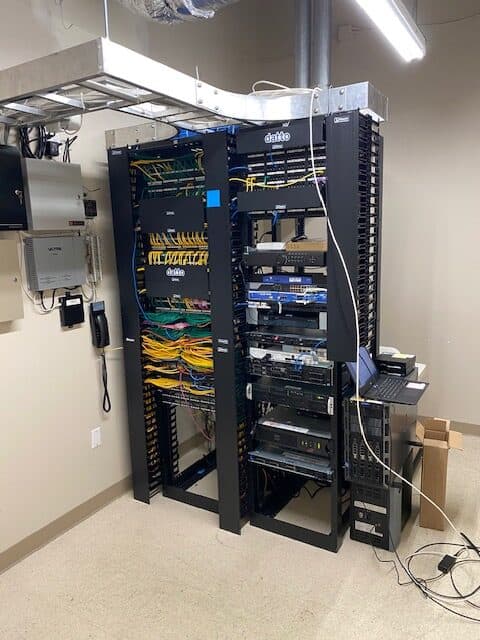 Professionally wired network and access-control equipment rack with structured low-voltage cabling