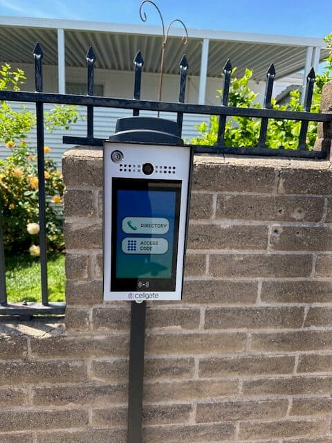 CellGate access-control intercom and keypad installed at a gated commercial entrance