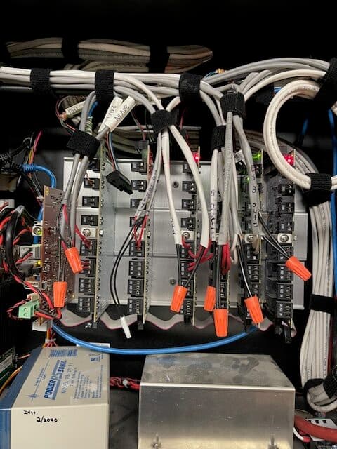 Integrated alarm and access control relay boards with labeled low-voltage wiring